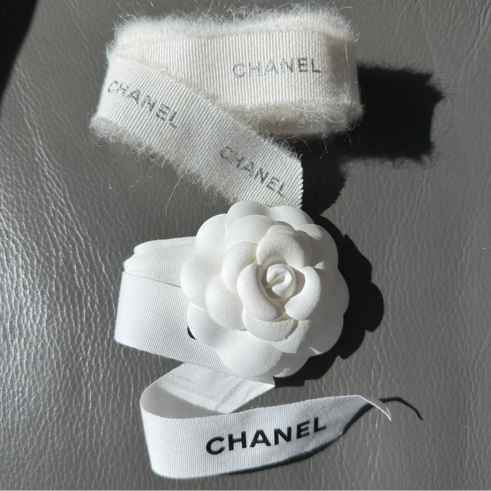 CHANEL 1 CAMELIA FLOWER AND Silver Chanel printed RIBBON,  plus Chanel card.